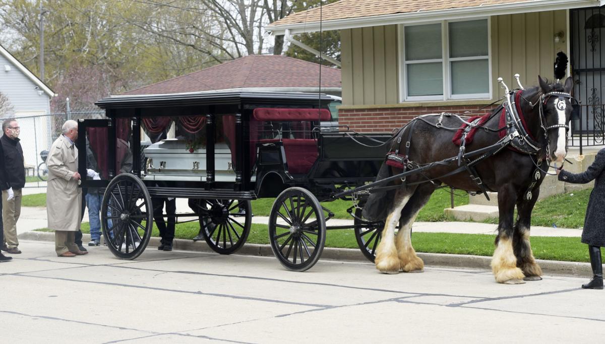 Coffin on horse carriage