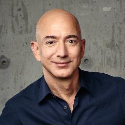 Jeff Bezos smiling in black shirt