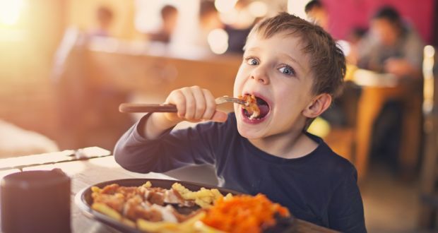 Little boy enjoying his delicious meal