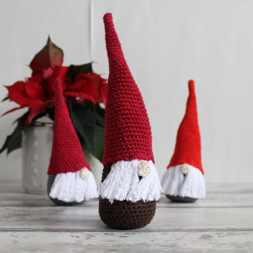 Three crochet christmas gnomes with red hats