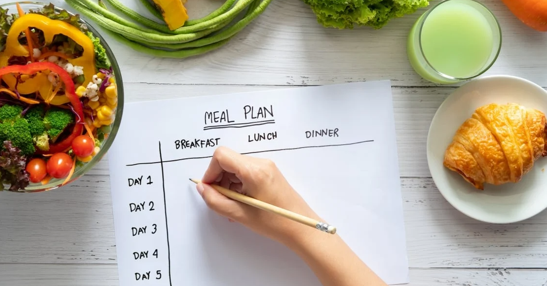 Person planning meals for the whole week