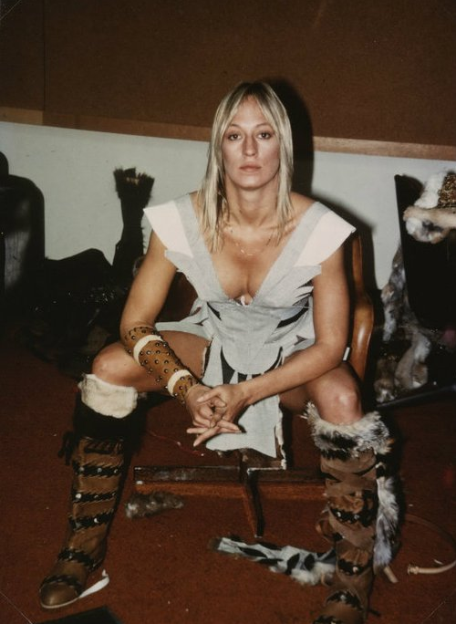 Sandahl Bergman wearing leather brown boots and minimal clothing for her character, Valeria, in Conan the Barbarian