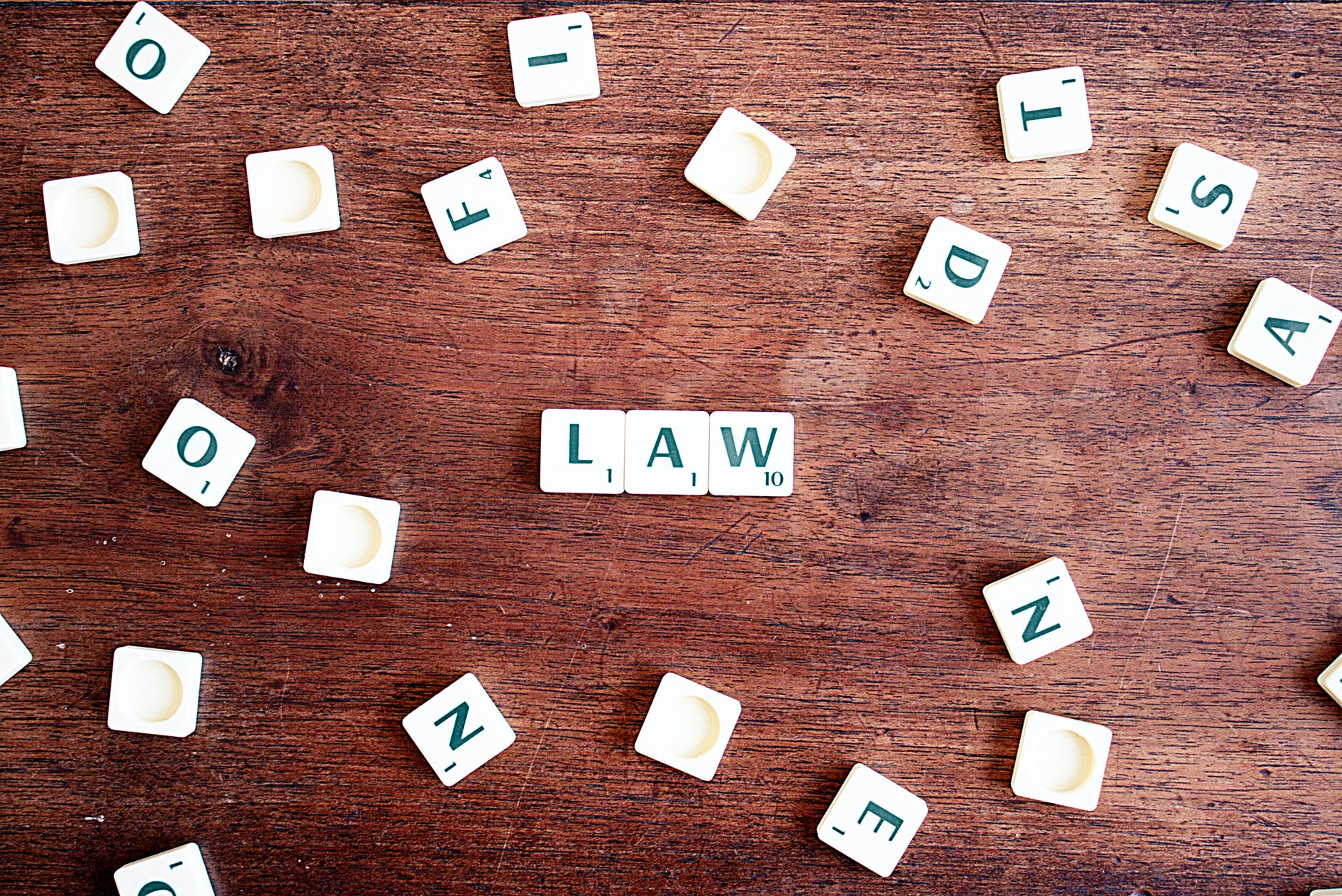 Scrabble letters making up "Law"