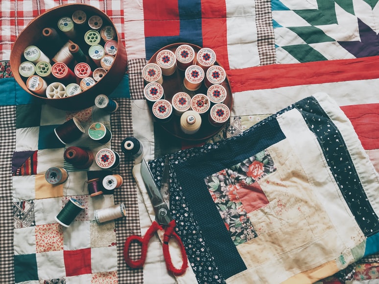 Sewing tools on top of a rag quilt