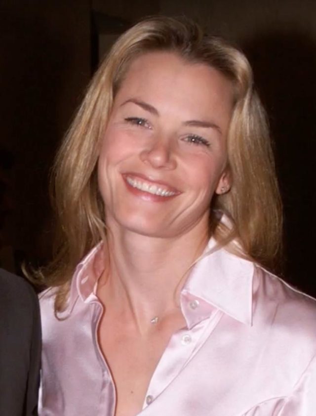 Melissa Mcknight headshot wearing a satin pink collared blouse