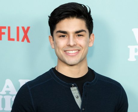 Diego Tinoco smiling for the Netflix premiere of On The Block