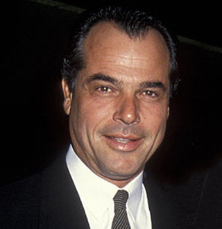 George Santo Pietro headshot wearing a suit in one of his movie premieres