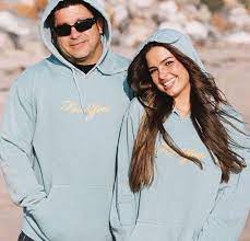 Monty Lopez and his daughter, Addison Rae wearing hoodies