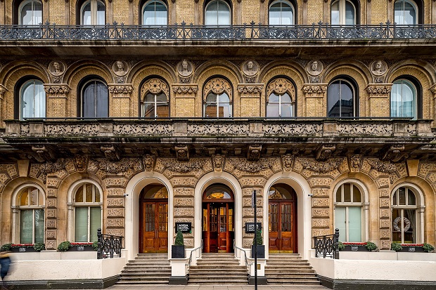 Façade of AMBA Hotel Grosvenor in London, with three arched main doors