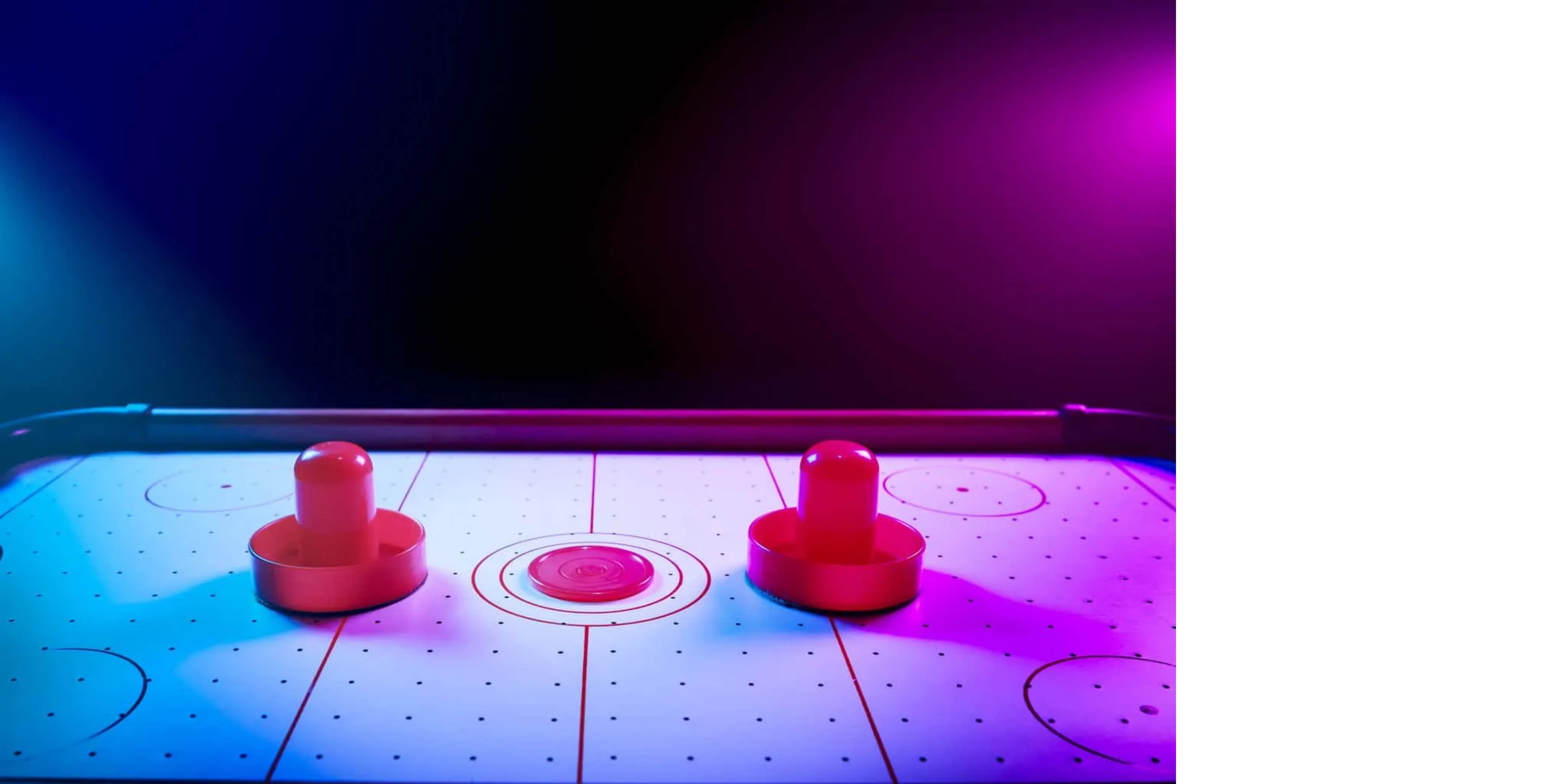 Sportcraft air hockey table with colorful lights that make you feel like you're in an arcade