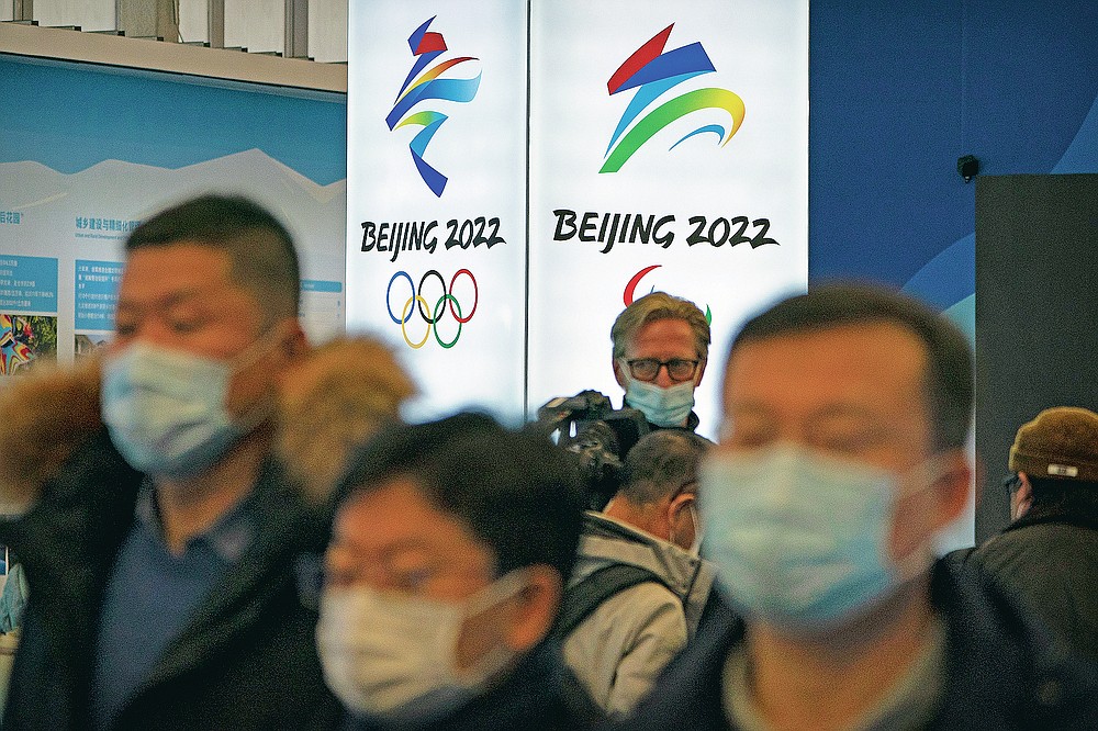 Beijing Olympics Banner with people wearing face masks
