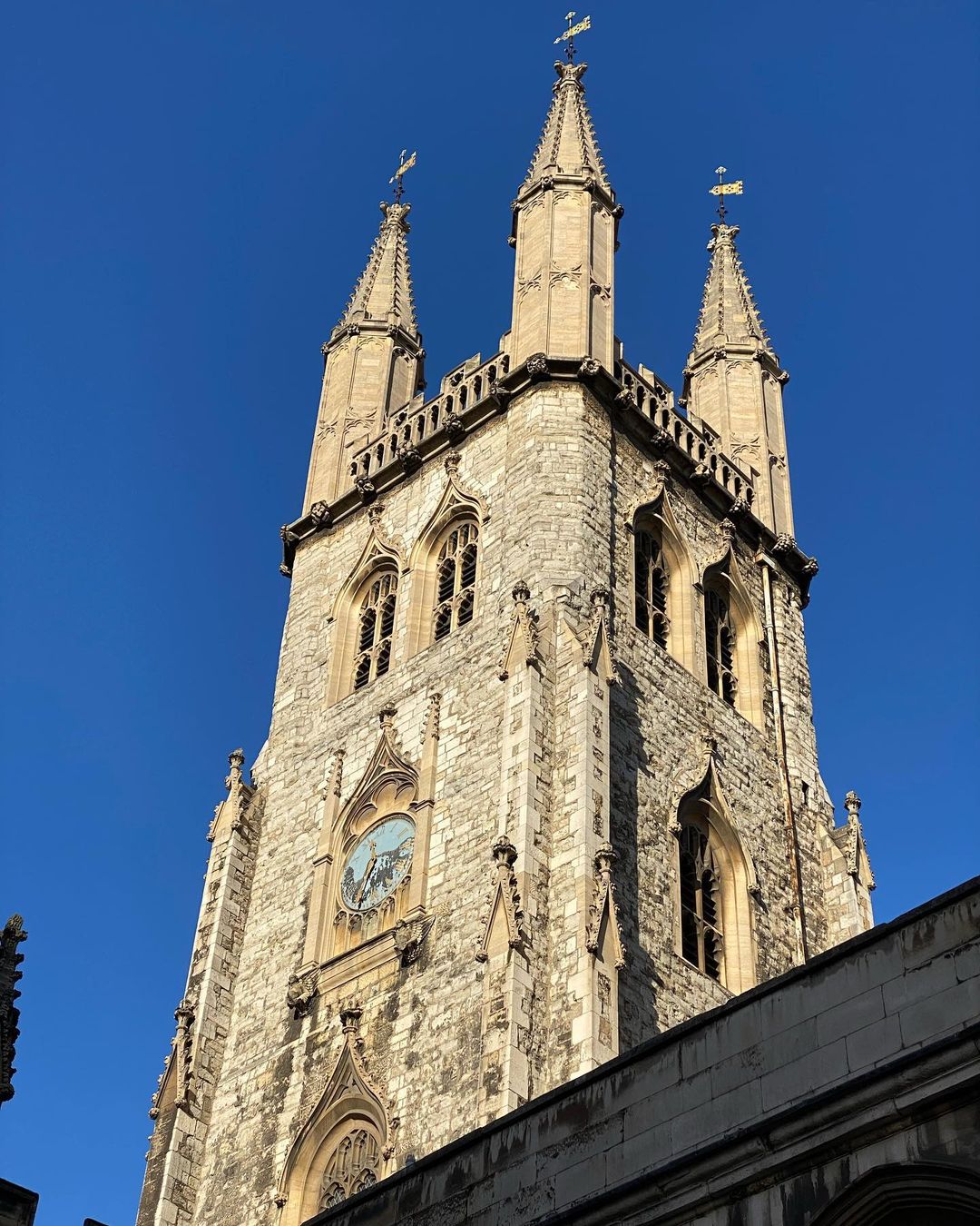 The bell tower of St. Sepulchre-without-Newgate in London, with four steeples, with one unseen