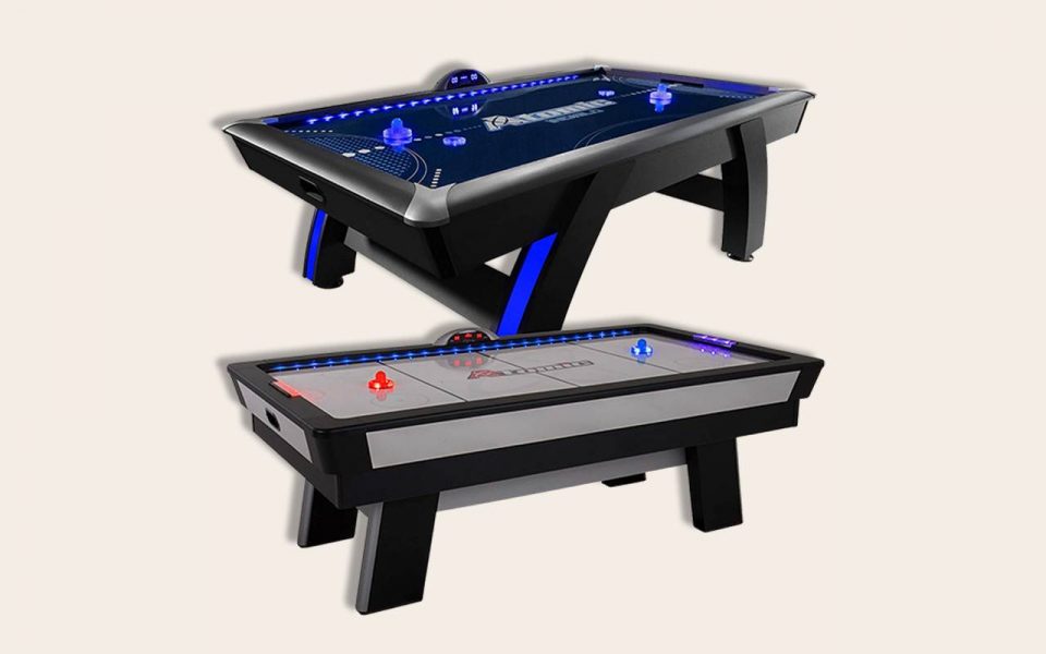 2 air hockey tables, a blue-black one and a gray-black one