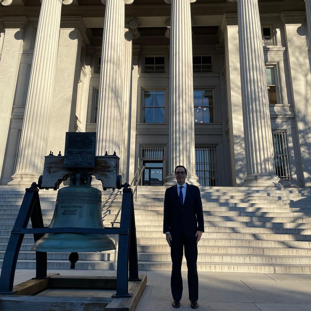 Steven Mnuchin stands beside the Liberty Bell replica outside the U.S. Treasury Building in Washington, D.C.