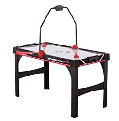 An air hockey table with an overhead LED scoring unit