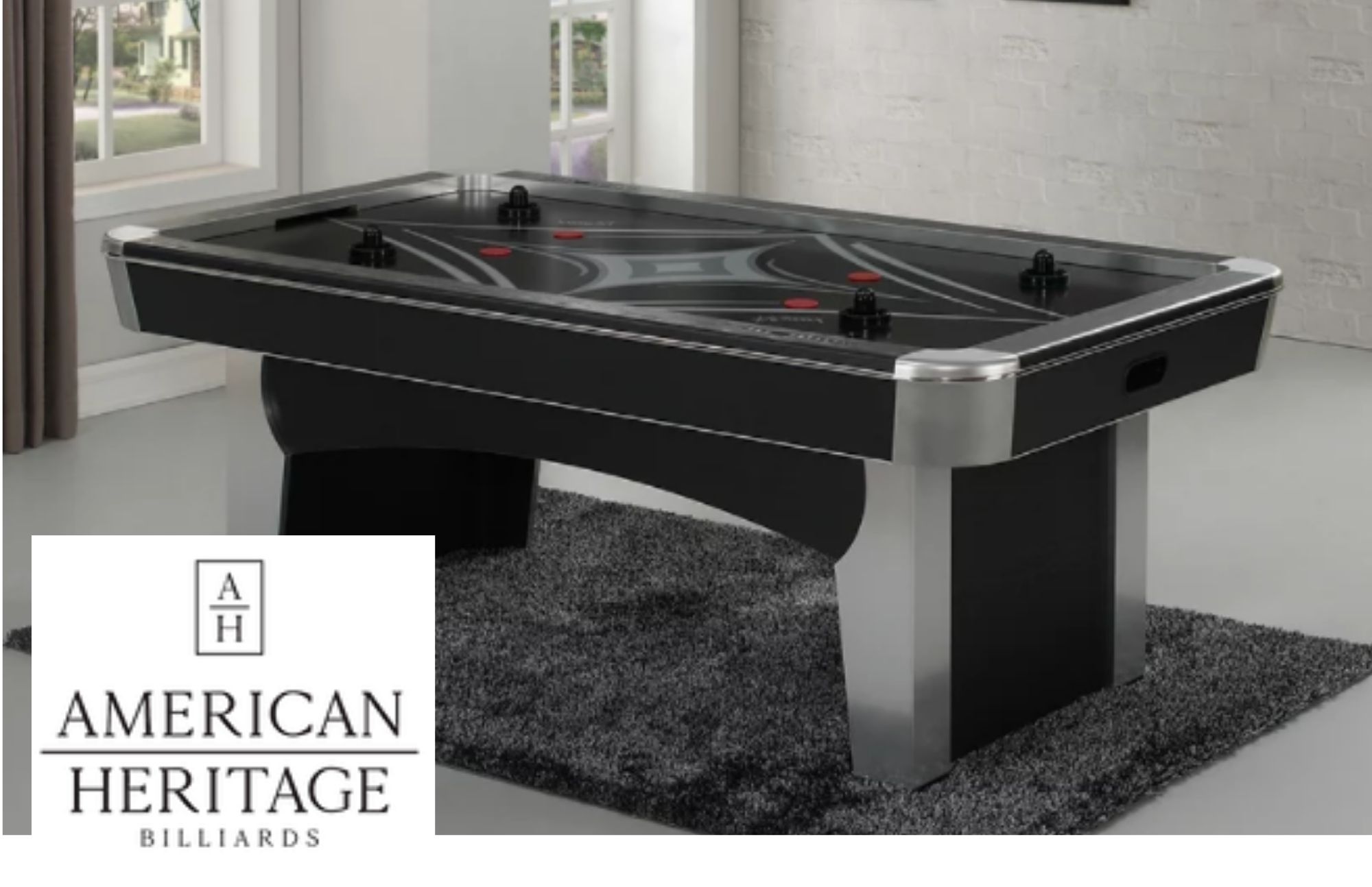 Inside the gaming room, Phoenix Air Hockey Table is set up under the gray blanket floor mat and American Heritage Logo on the lower-left corner