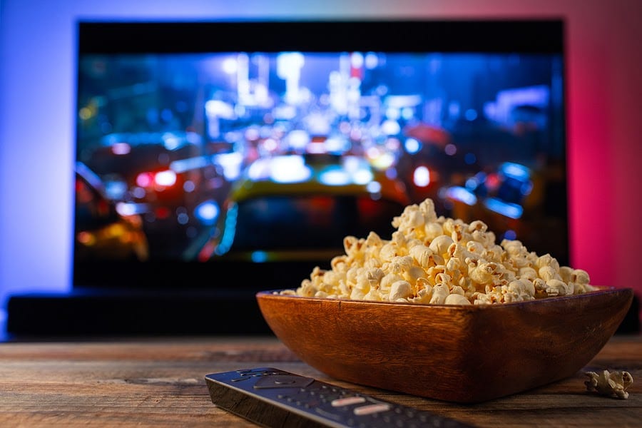 Popcorn in a bowl in front of a Television