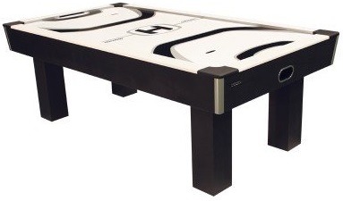 An entirely black with a black and white playing surface air hockey table