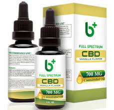 Two closed bottles of B+ Pure CBD tinctures with the box on its side