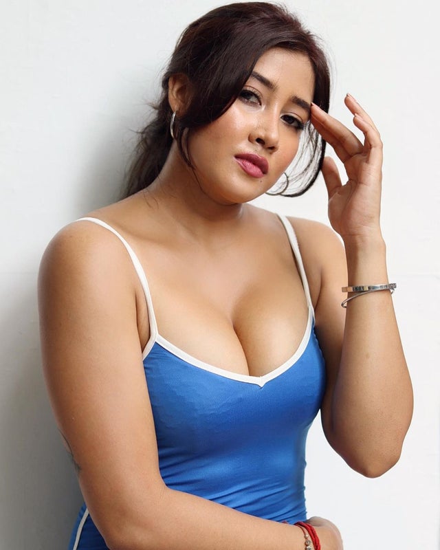 Sofia Ansari showing cleavage in blue top