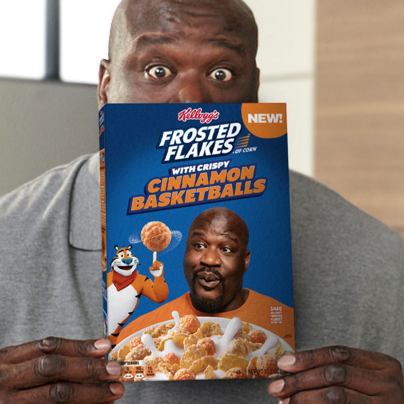 Shaquille O'Neal holding a box of Kellogg’s Frosted Flakes with Crispy Cinnamon Basketballs