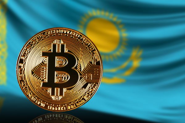 Bitcoin and Kazakhstan flag at the back