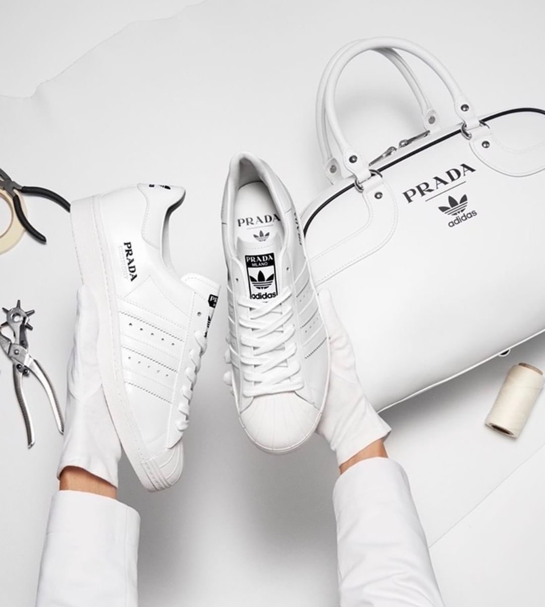 Adidas white shoes and bag in collaboration with Prada