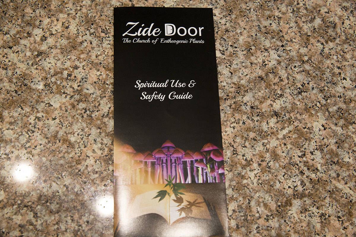 Zide Door church pamphlet placed on a brown marble surface