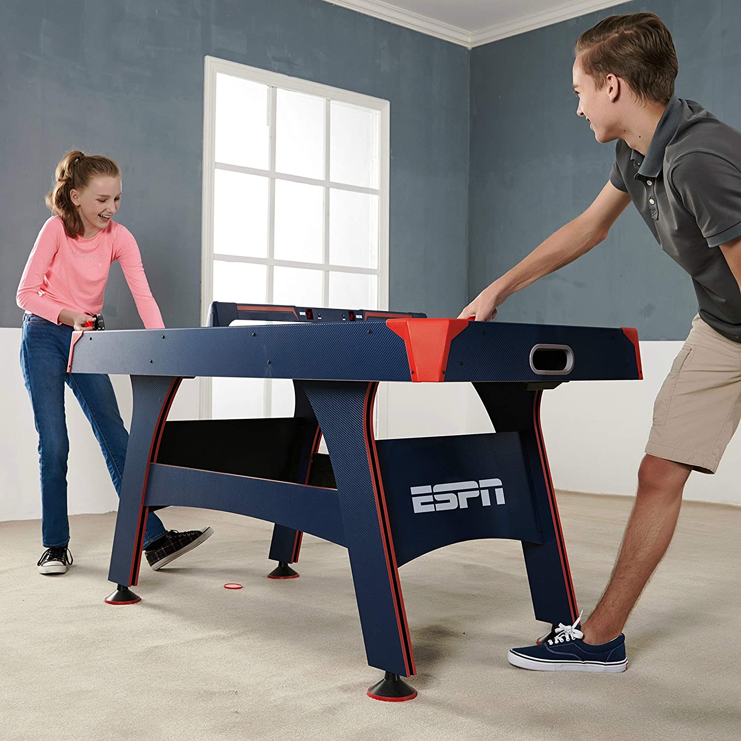 Two kids playing on a ESPN 5' Air Powered Hockey Table
