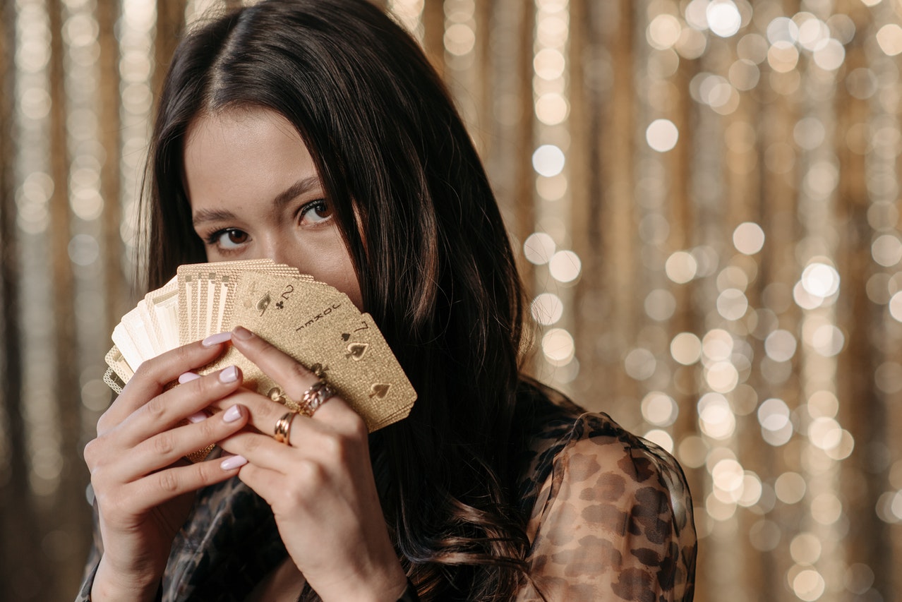 Close-Up Shot of a Woman Holding Cards