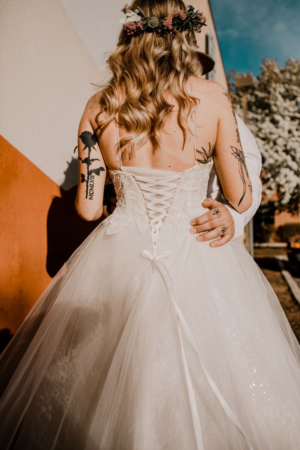 Woman from behind in a white wedding dress