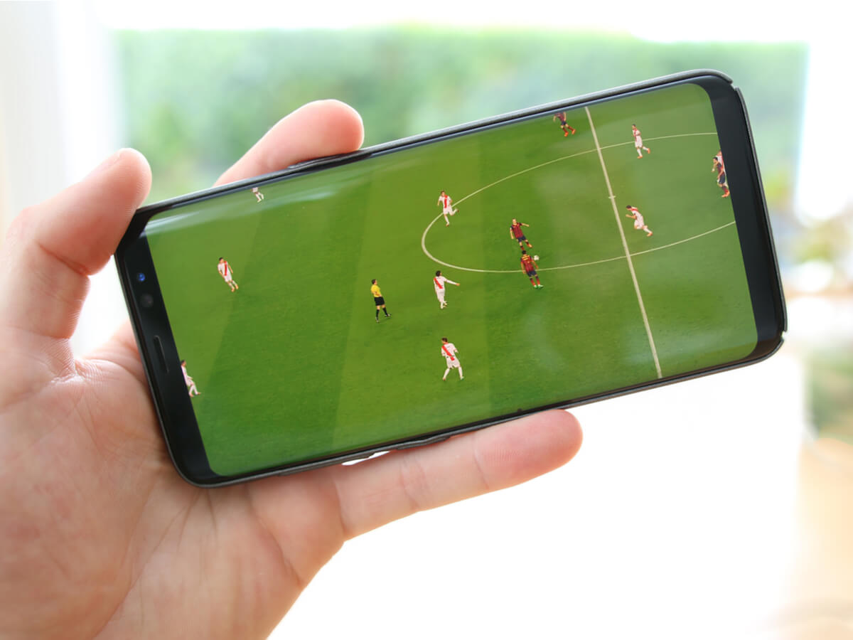 Players playing football on a mobile screen