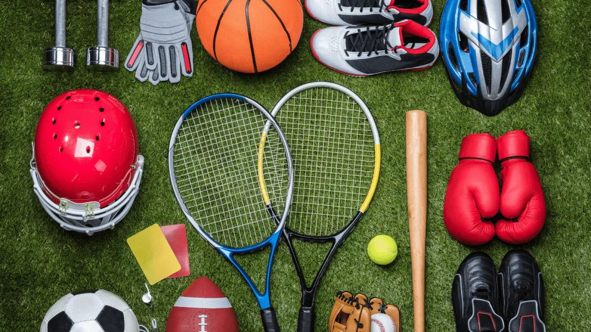 Different kinds of sports items placed on grass