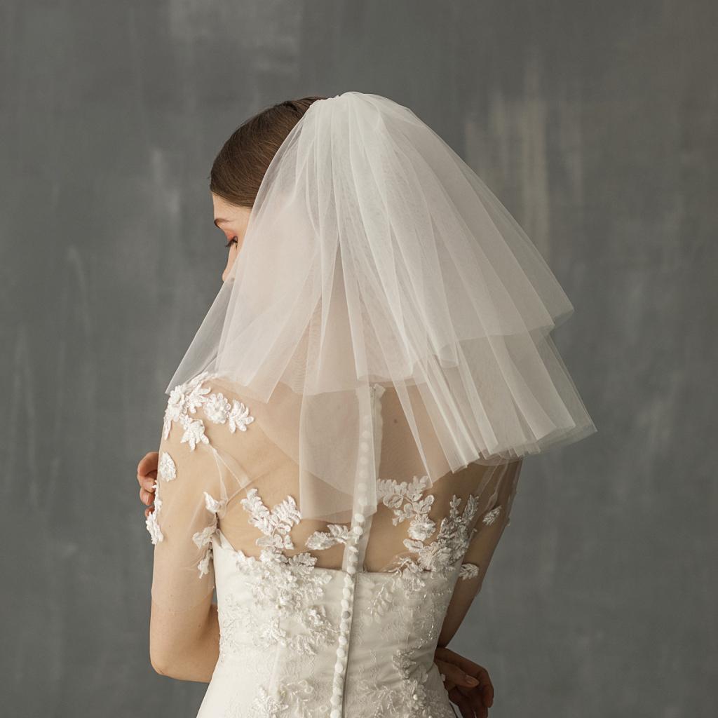 Bride in a short white veil