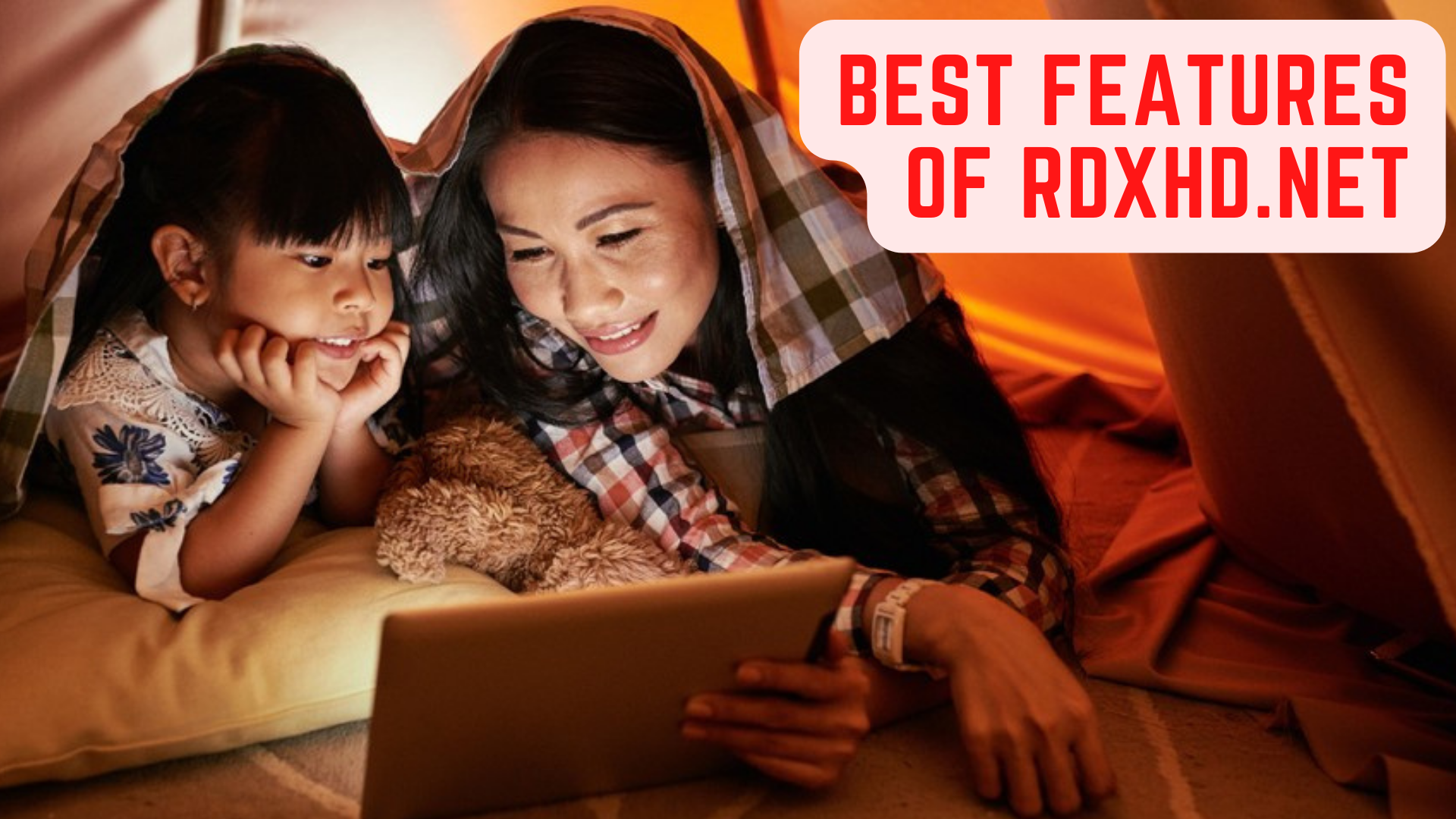 Two people watching movie from a tablet with words Best Features Of Rdxhd.net