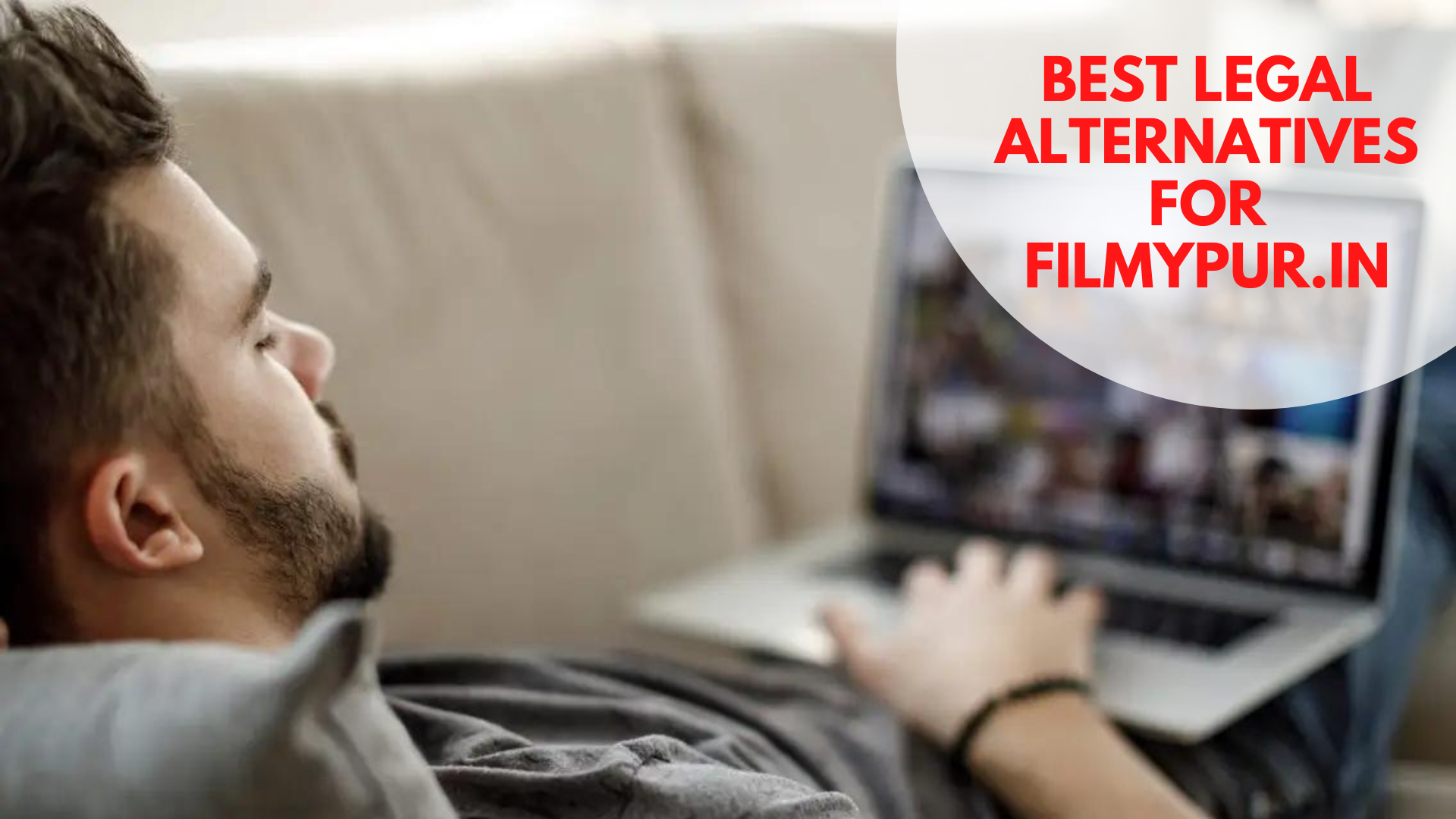 A man lying on a couch while watching from his laptop with words Best Legal Alternatives For Filmypur.in