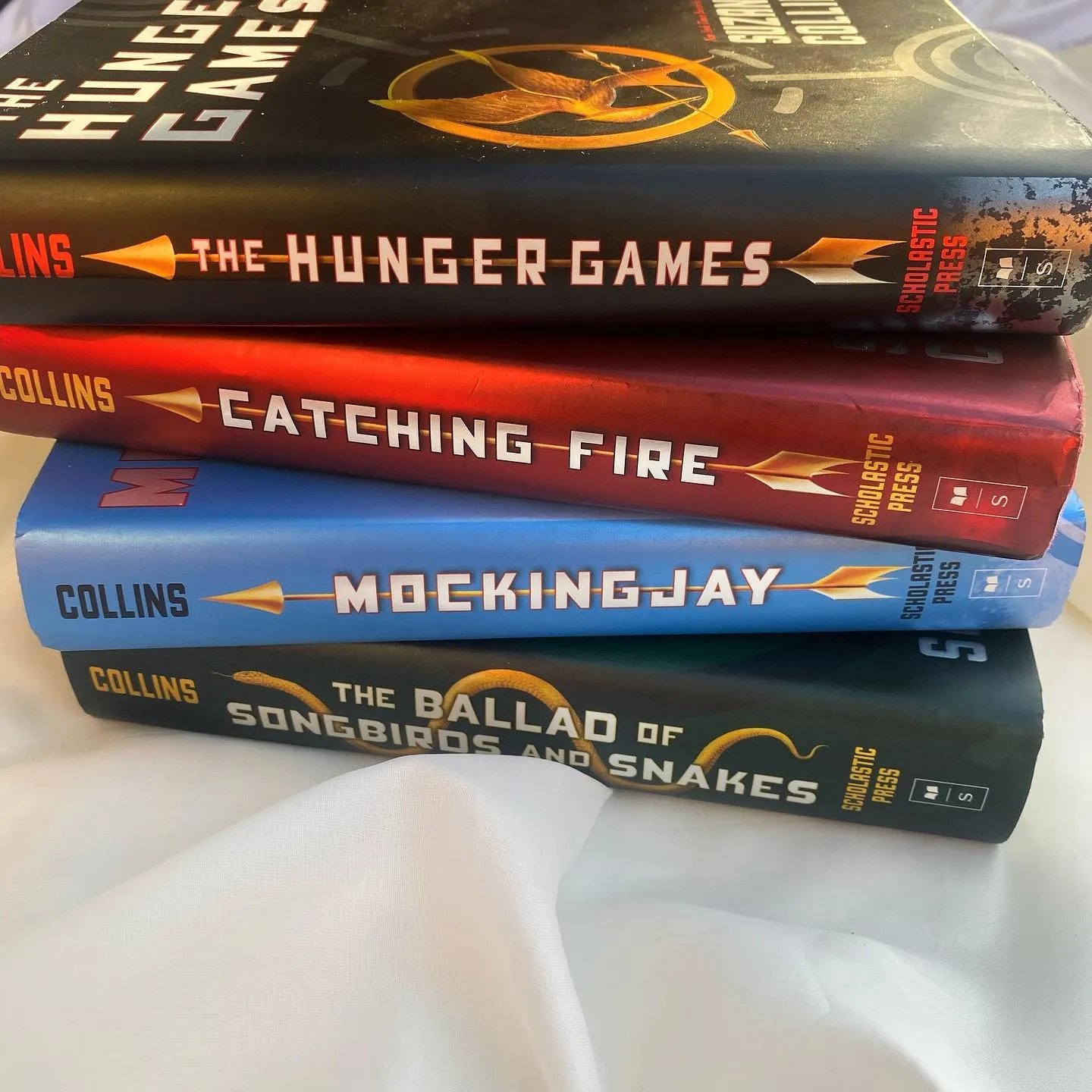 All four “The Hunger Games” books stacked up