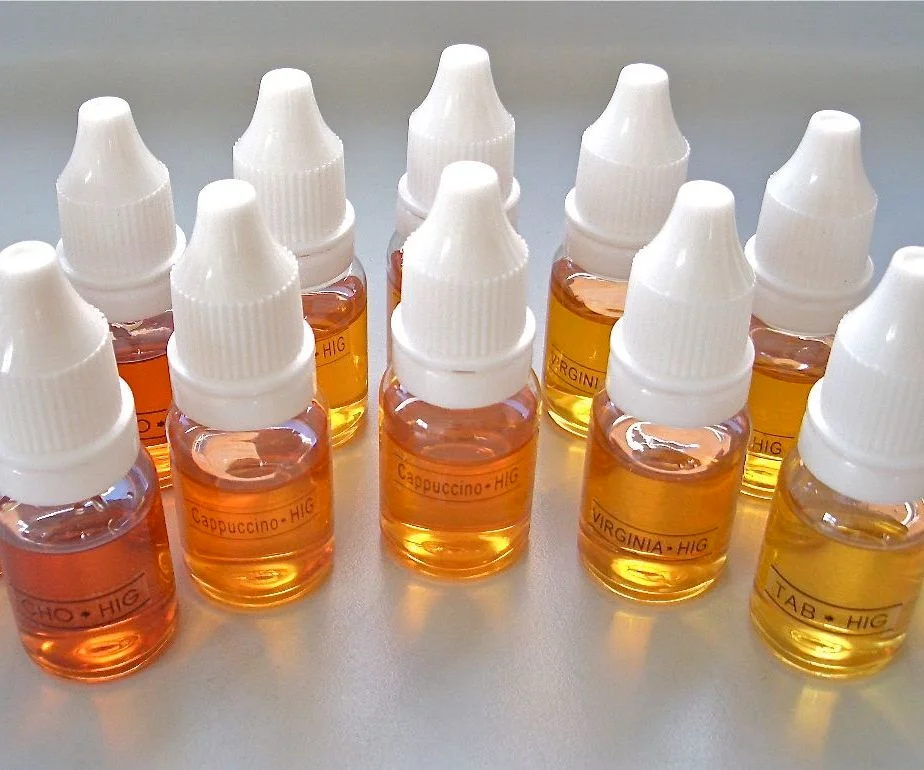 10 small e-liquid bottles