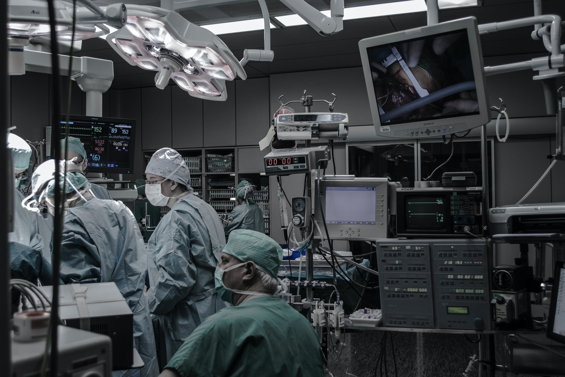 A group of doctors is working in an operation theater 