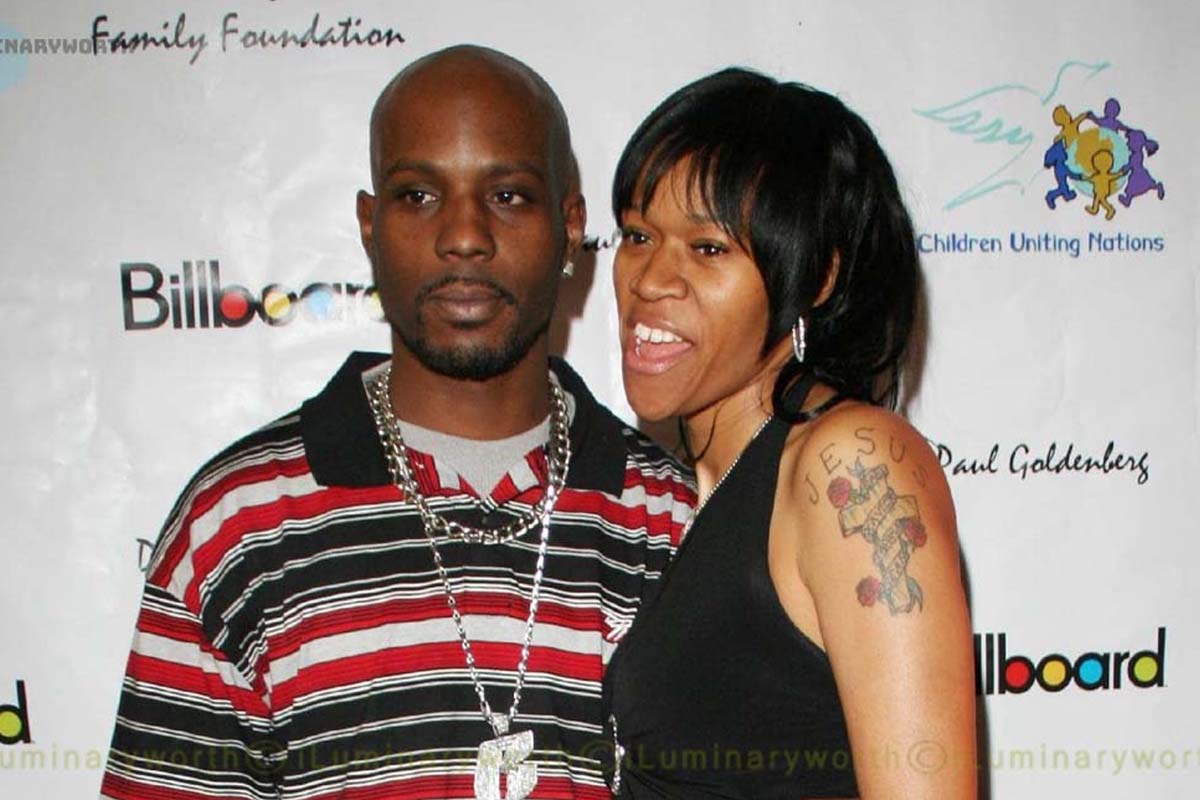 DMX wearing a stripes polo shirt and Tashera wearing a sleeveless top smiling