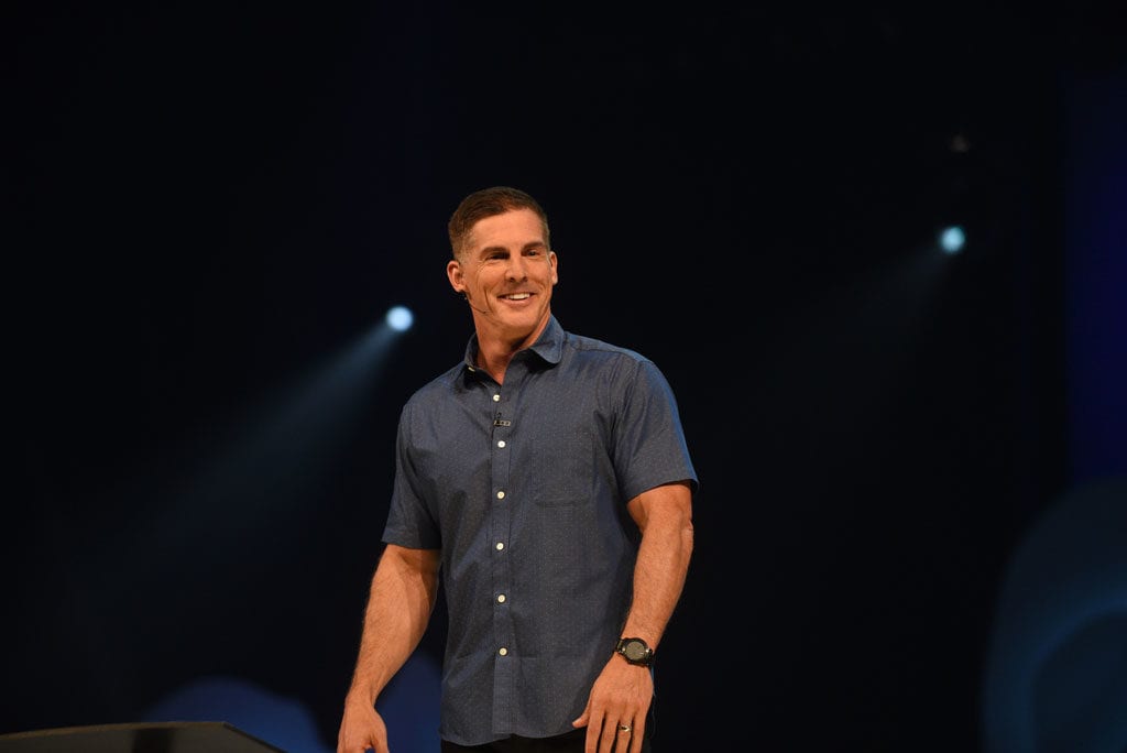 Craig Groeschel wearing a blue polo with a headset microphone
