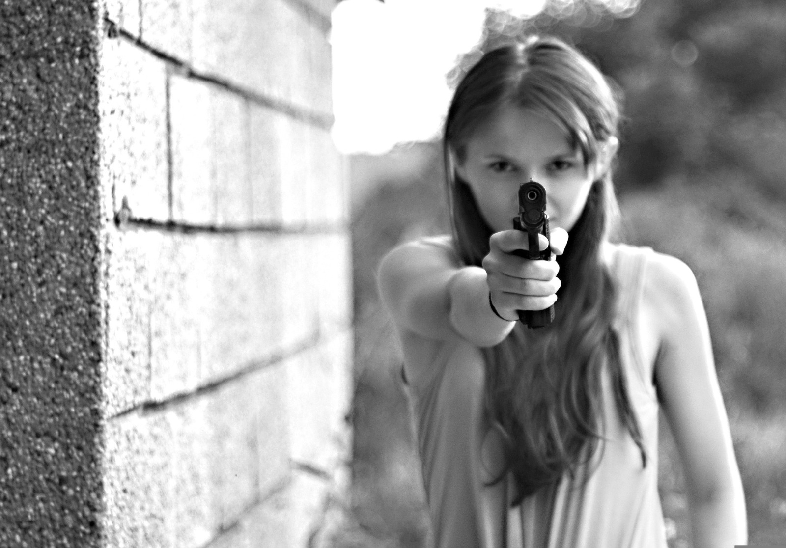 A Girl Pointing A Gun At Someone