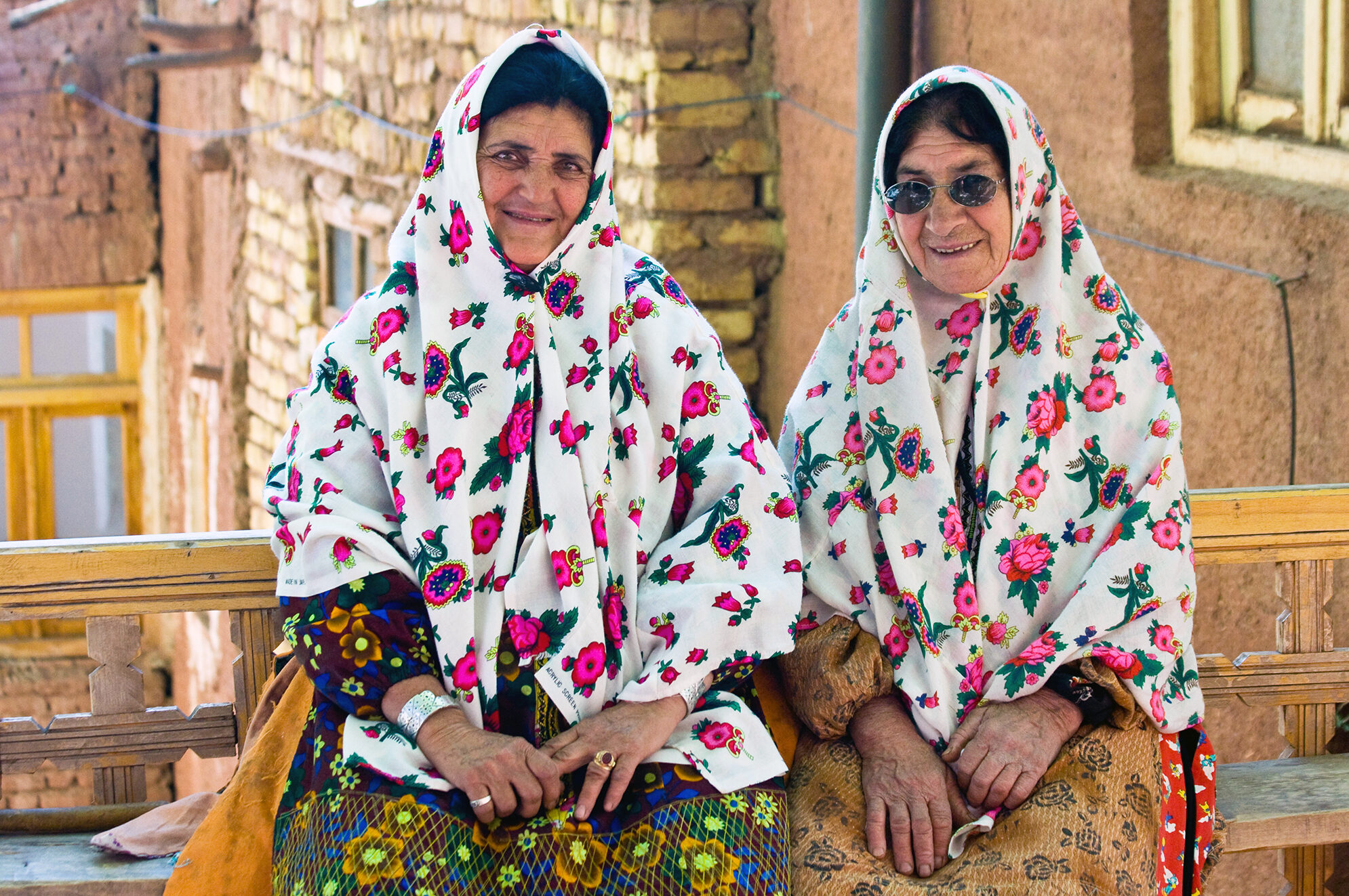 2 elderly Iranian women in their traditional clothes