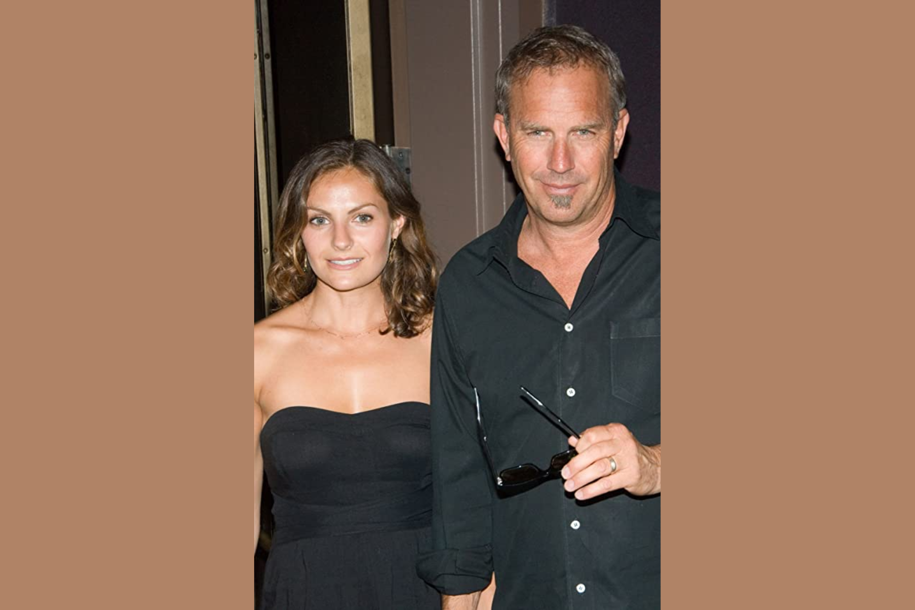 Annie Costner and her father Kevin walking while holding each other's hand