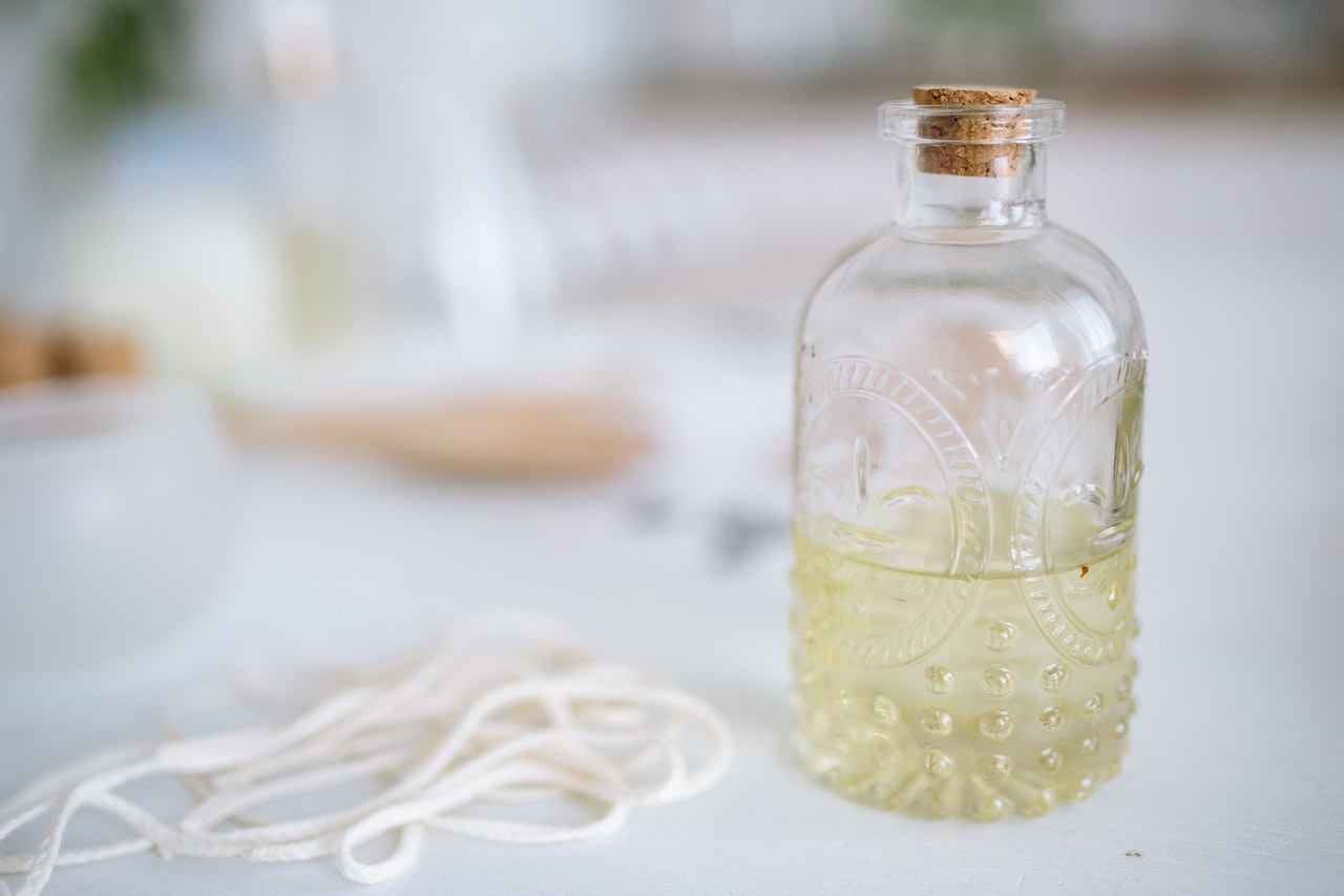 Essential Oil In A Clear Glass Bottle With A Cork