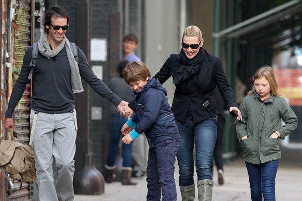 Joe skating on the street side with his family