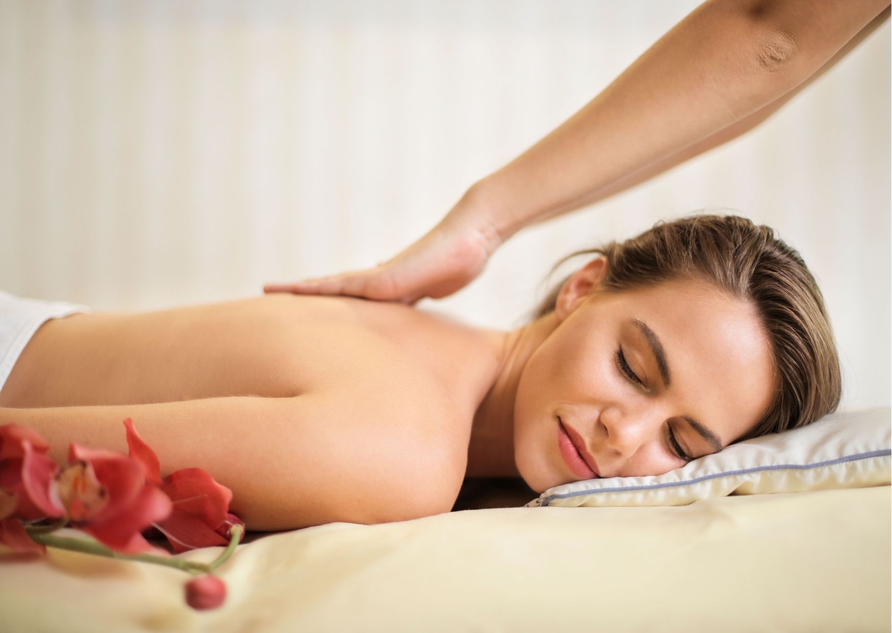 A beautiful girl receiving back massage