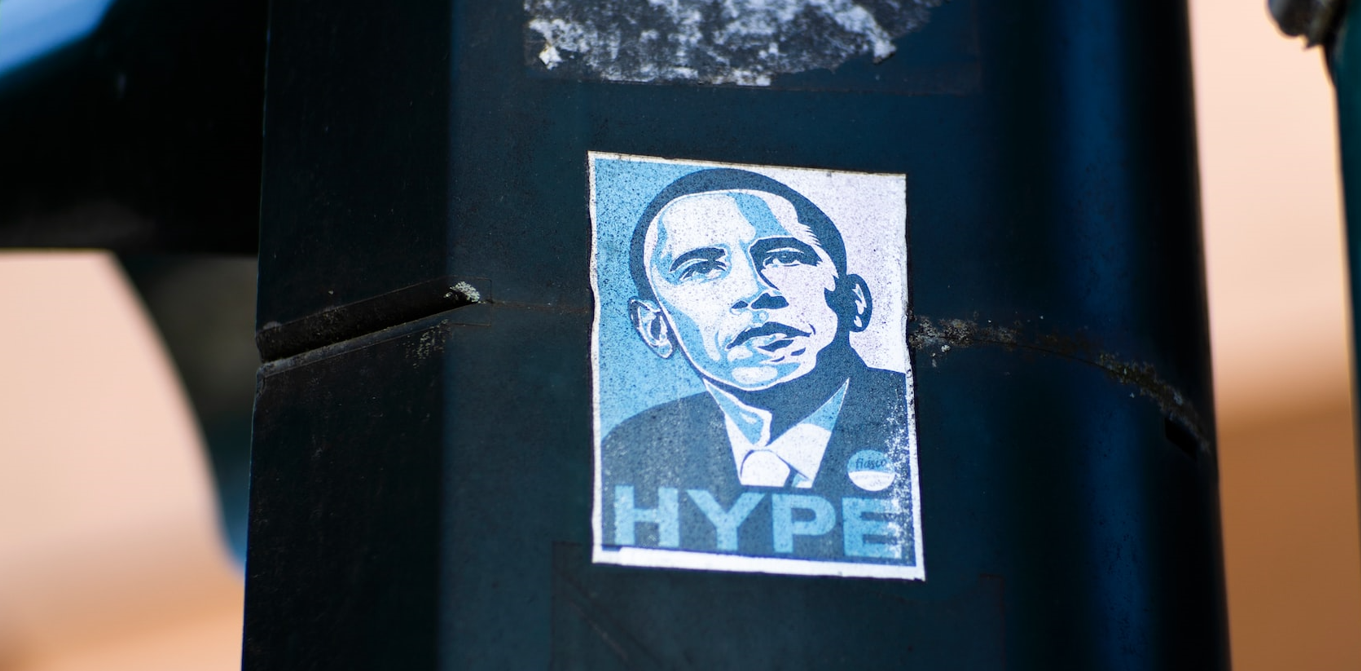 Barack Obama in black, white, and blue paint and the word ‘Hype’ on his chest in uppercase form