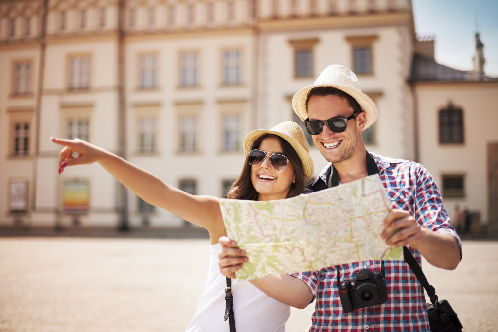 A couple traveling with a map