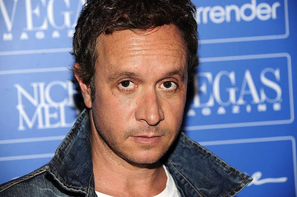 Pauly Shore wearing a jean blue t-shirt at an event